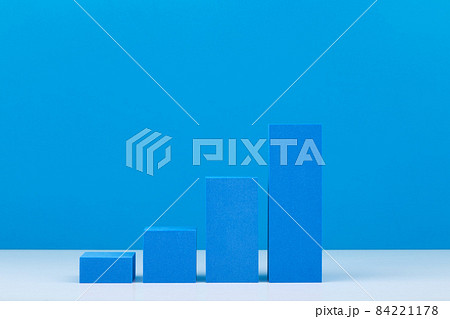 Business performance chart with rise dynamic against blue background with copy space 84221178