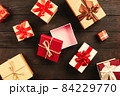 Christmas background with gift boxes on wooden table 84229770