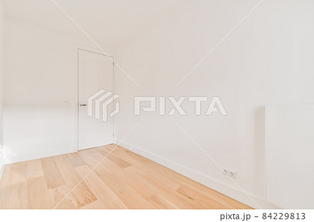 Pretty bright empty room with white walls Pretty bright empty room with white walls 84229813