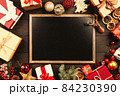 Christmas background with gift boxes on wooden table 84230390