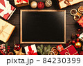 Christmas background with gift boxes on wooden table 84230399