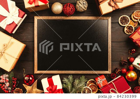 Christmas background with gift boxes on wooden table 84230399