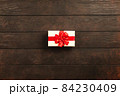 Christmas background with gift boxes on wooden table 84230409