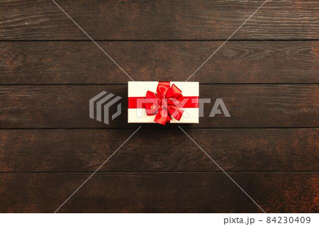 Christmas background with gift boxes on wooden table 84230409