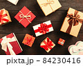 Christmas background with gift boxes on wooden table 84230416