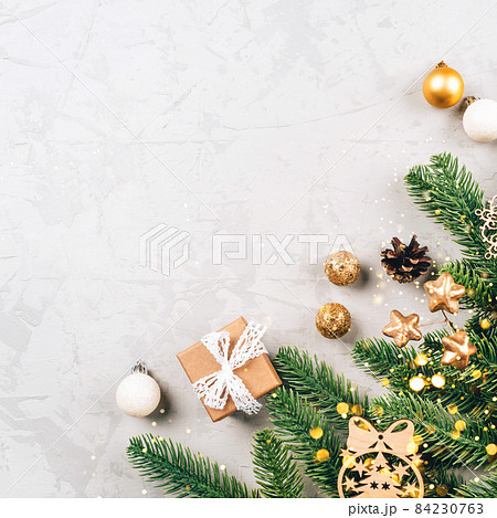 Christmas composition of fir tree branches and decorations. 84230763