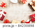Christmas background with gift boxes on wooden table 84230898