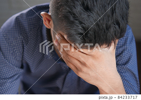 Depressed man feeling sick and worried about financial problem Depressed man feeling sick and worried about financial problem 84233717