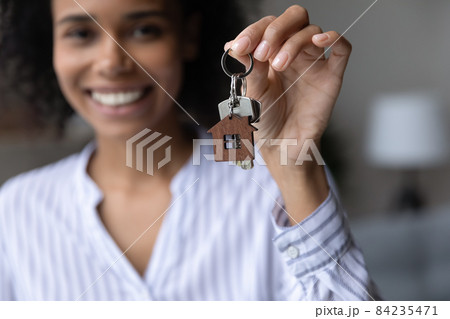 Close up focus on keys in African American woman hand Close up focus on keys in African American woman hand 84235471