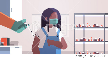doctor hand vaccinating african american girl patient in medical mask fight against coronavirus vaccine development 84236804