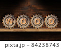 Four Cogwheels on a Wooden Shelf with Text Wood and Copy Space 84238743