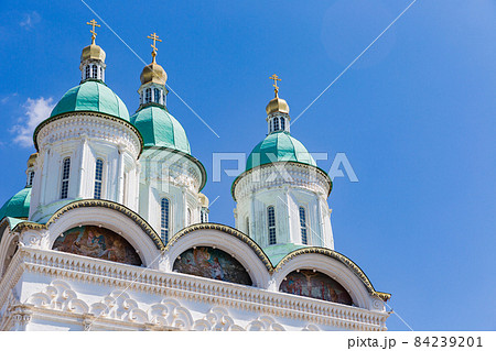 green-blue domes of Cathedral in Astrakhan kremlin with bright blue sky green-blue domes of Cathedral in Astrakhan kremlin with bright blue sky 84239201