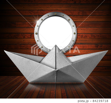 Paper Boat inside a Wooden Ship with Empty Metal Porthole Paper Boat inside a Wooden Ship with Empty Metal Porthole 84239718