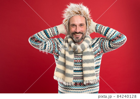 A winter ensemble protects him from cold. Mature A winter ensemble protects him from cold. Mature 84240128