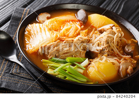 Gamja-tang or pork backbone stew is a spicy Korean soup close up in the bowl. Horizontal Gamja-tang or pork backbone stew is a spicy Korean soup close up in the bowl. Horizontal 84240204