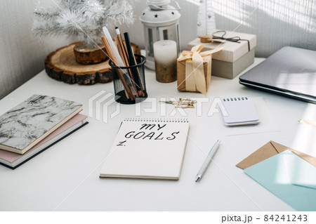 New goals, New year resolution. Handwritten Text My goals in open notepad on the table. Start new year, planning and setting goals for the next year 84241243