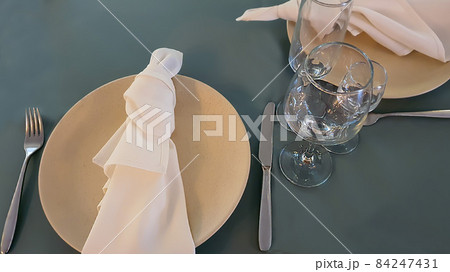 Festive table setting in the restaurant. Wedding preparations. Selective focus. 84247431
