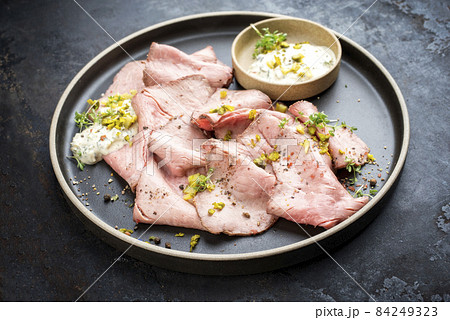 Traditional lunch meat with sliced cold cuts roast beef and remoulade 84249323