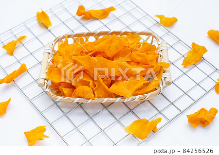 Sweet potato chips on white background. Sweet potato chips on white background. 84256526