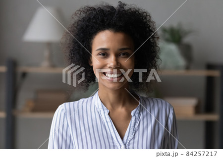 Head shot portrait of attractive smiling African American woman Head shot portrait of attractive smiling African American woman 84257217