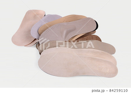 Orthopedic insole on a white background. Treatment and prevention of flat feet and foot diseases. Foot care, comfort for the feet. Wear comfortable shoes. Medical insoles. Flat Feet Correction. Orthopedic insole on a white background. Treatment and prevention of flat feet and foot diseases. Foot care, comfort for the feet. Wear comfortable shoes. Medical insoles. Flat Feet Correction. 84259110