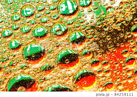 Oil drops on green background 84259111