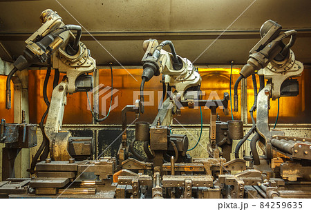Robots welding team in the automotive 84259635