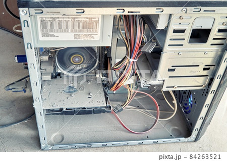 Opened old desktop pc is covered with a thick layer of dust 84263521