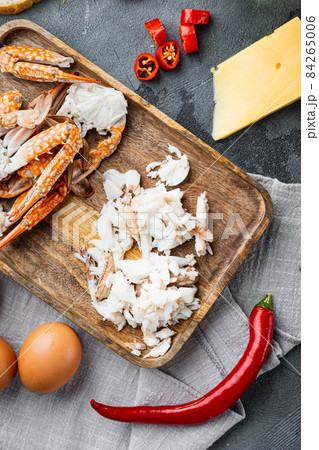 Chilli crab silky omlette ingredients, on gray background, top view flat lay Chilli crab silky omlette ingredients, on gray background, top view flat lay 84265006