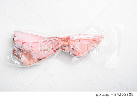 Snapper fish frozen pack meat, on white stone table background, top view flat lay, with copy space for text Snapper fish frozen pack meat, on white stone table background, top view flat lay, with copy space for text 84265309