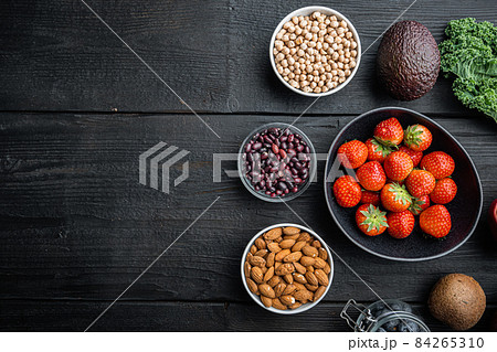 Healthy products immunity boosters , flat lay with space for text, on black wooden background 84265310