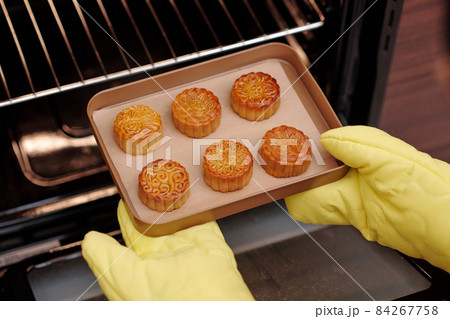 Person Baking Glazed Mooncakes 84267758
