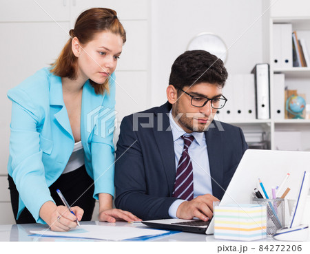 Business partners working in office Business partners working in office 84272206