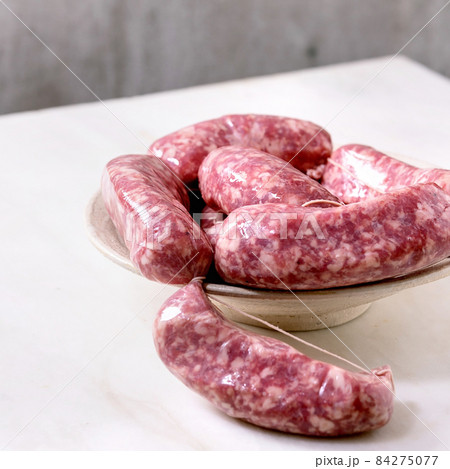 Bunch of raw uncooked italian sausages salsiccia Bunch of raw uncooked italian sausages salsiccia 84275077