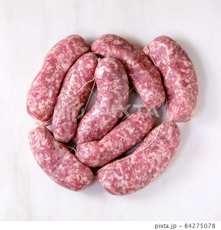 Bunch of raw uncooked italian sausages salsiccia Bunch of raw uncooked italian sausages salsiccia 84275078