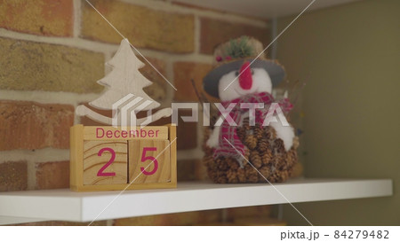 December twenty-fifth, wooden calendar. New Year's Eve. Christmas. Close-up 84279482