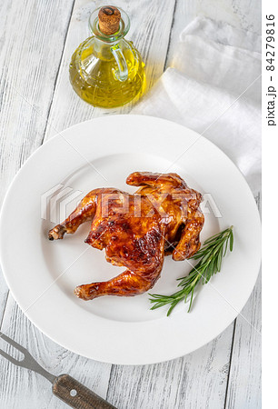 Roasted chicken on the white plate 84279816