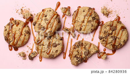 Cookies with caramel on pink background, space for text Cookies with caramel on pink background, space for text 84280936