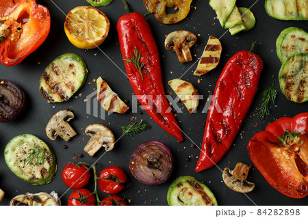 Tasty grilled vegetables on black background, top view 84282898