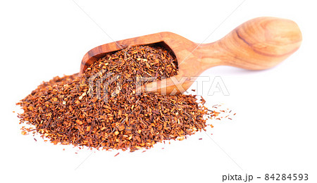 Rooibos red tea in wooden scoop, isolated on white background. Traditional herbal and organic tea. 84284593