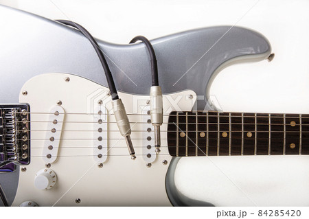 Silver electric guitar isolated on white background 84285420