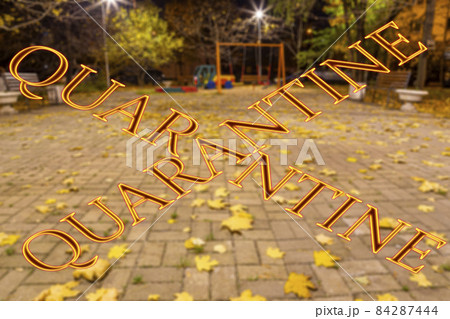 Coronavirus in Moscow, Russia. An empty playground on an autumn night in one of the residential areas (blurry view). Quarantine sign. Concept of COVID pandemic and travel Coronavirus in Moscow, Russia. An empty playground on an autumn night in one of the residential areas (blurry view). Quarantine sign. Concept of COVID pandemic and travel 84287444