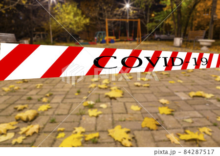 Coronavirus in Moscow, Russia. An empty playground on an autumn night in one of the residential areas (blurry view). Covid-19 sign. Concept of COVID pandemic and travel. Coronavirus in Moscow, Russia. An empty playground on an autumn night in one of the residential areas (blurry view). Covid-19 sign. Concept of COVID pandemic and travel. 84287517