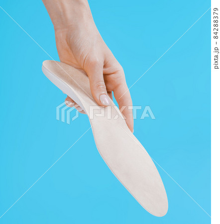 Orthopedic insole isolated on a blue background. Medical insoles. Treatment and prevention of flat feet and foot diseases. Foot care, feet comfort. Wear comfortable shoes. Flat Feet Correction. Orthopedic insole isolated on a blue background. Medical insoles. Treatment and prevention of flat feet and foot diseases. Foot care, feet comfort. Wear comfortable shoes. Flat Feet Correction. 84288379