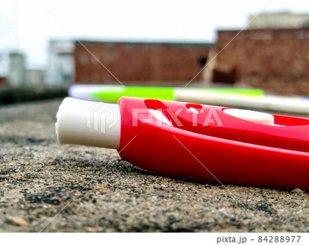 Selective focus shot of a red pen on a wall 84288977