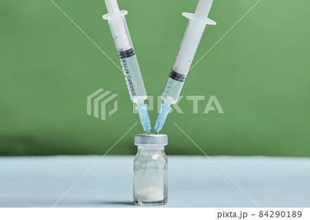 A covid-19 vaccine vial with syringes. Covid-19 vaccine booster dose. Booster shot of new coronavirus vaccine injection A covid-19 vaccine vial with syringes. Covid-19 vaccine booster dose. Booster shot of new coronavirus vaccine injection 84290189