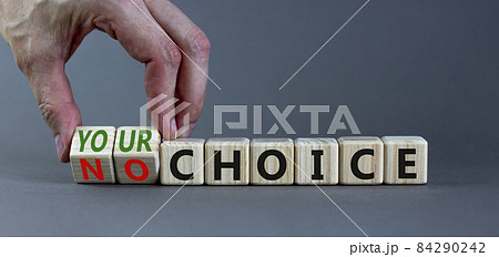 No or your choice symbol. Businessman turns wooden cubes and changes words 'no choice' to 'your choice'. Beautiful grey background, copy space. Business and no or your choice concept. 84290242