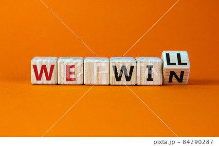 We will win symbol. Turned a wooden cube and changed words we will to we win. Beautiful orange background, copy space. Business, motivational and we will win concept. We will win symbol. Turned a wooden cube and changed words we will to we win. Beautiful orange background, copy space. Business, motivational and we will win concept. 84290287