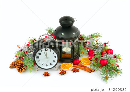 Christmas decor, alarm clock, lantern and spruce twigs isolated on white background. 84290382