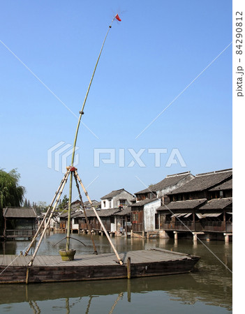 Wuzhen Water Town, Zhejiang Province, China. A bamboo pole used by acrobats to perform for tourists visiting Wuzhen Canal Town. 84290812